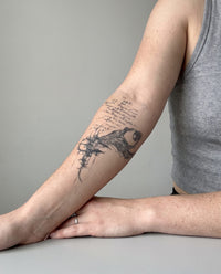 Eye Of Sacrifice Script semi-permanent tattoo on forearm