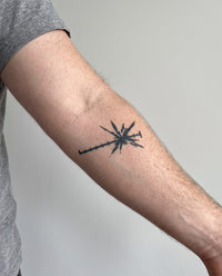 Syringe Burst semi-permanent tattoo on forearm