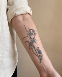 Thorn Rose Cross semi-permanent tattoo on inner forearm