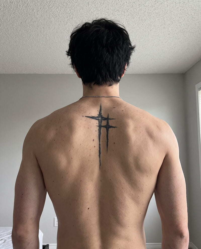 Twin Crosses semi-permanent tattoo on upper back